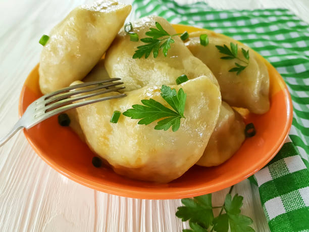 istock dumplings parsley, green onions on a white wooden background fork 968502148