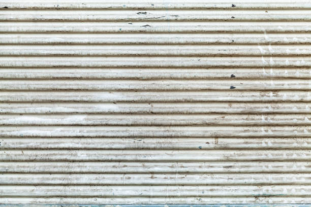 istock Old white grungy corrugated metal wall 968509020
