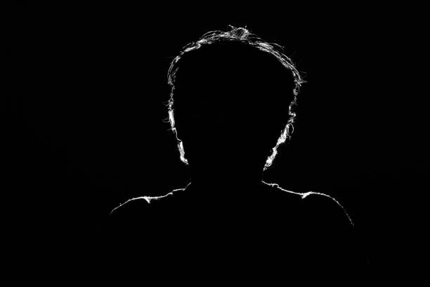 istock Unknown male person silhouette on black background 968509846