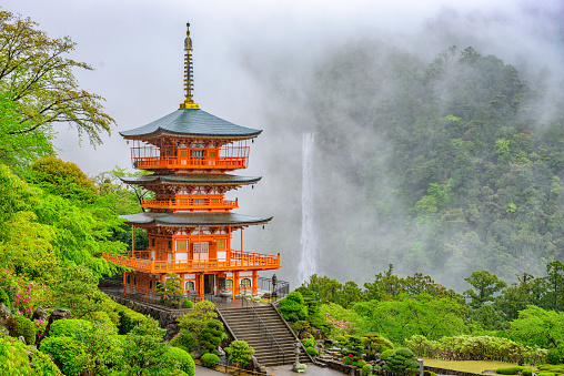 Nacho, Japan - April 21, 2014: Kumano Nachi Taisha Pagoda and waterfall on a misty day.