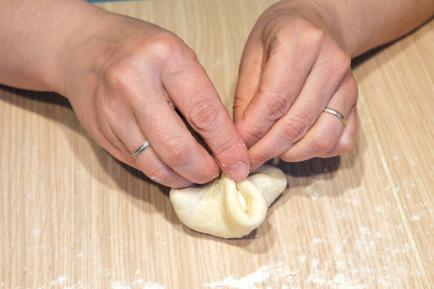 istock woman makes homemade cakes from dough 968516958