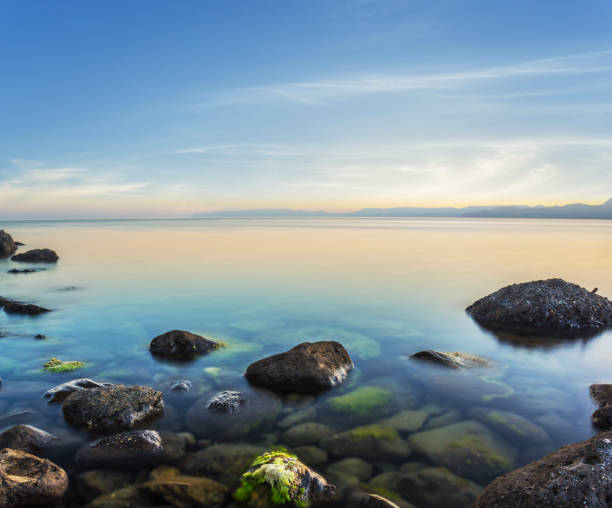 istock quiet sea coast with stones at the dusk 968517316