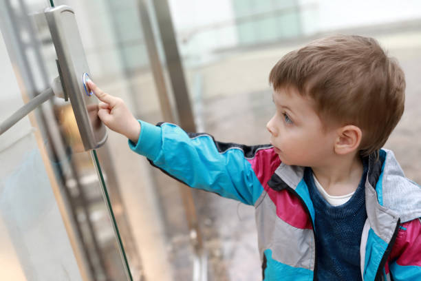 Child in front of elevator stock photo
