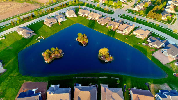 istock Beautiful homes around pond with islands. 968523396