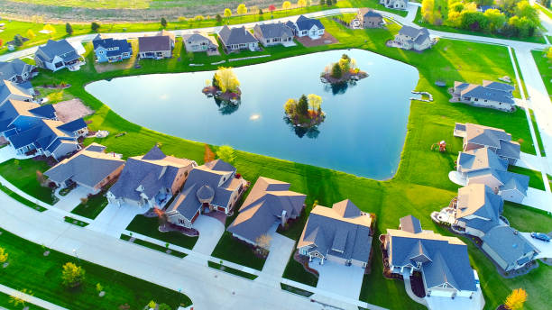 istock Beautiful homes around pond with islands. 968523508