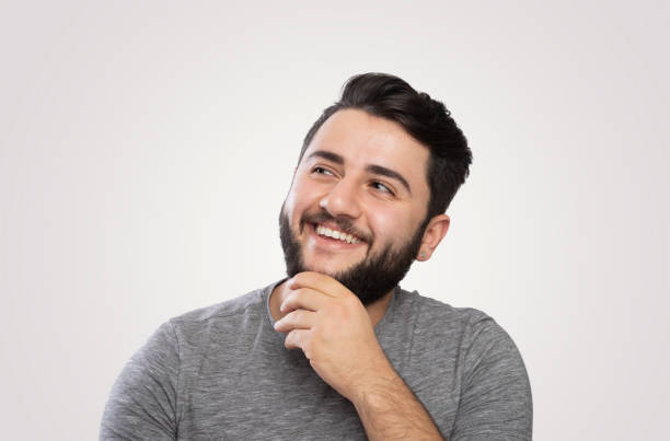 istock Portrait of a thoughtful young man,smiling 968524042