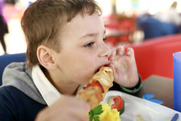 istock Child eating chiken kebab 968526686