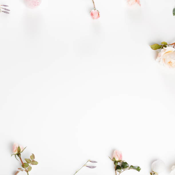 istock Festive flower composition on the white wooden background. Overh 968526888