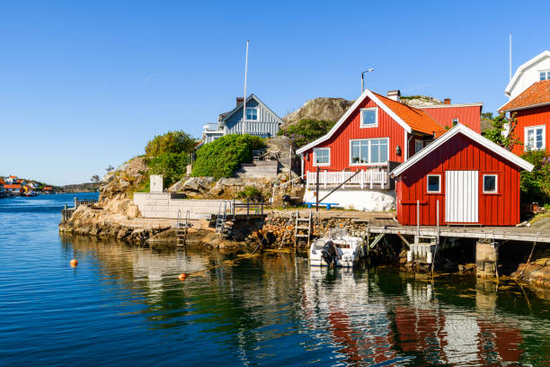 Kyrkesund village homes Typical homes and buildings at the seaside village of Kyrkesund on Tjorn, Sweden. It is a sunny and calm day at the coast. västra götaland county stock pictures, royalty-free photos & images