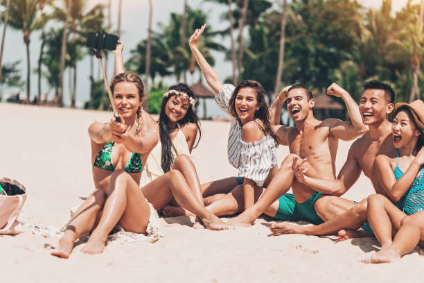 istock Multi-ethnic group of friends making a selfie on the beach 968532814