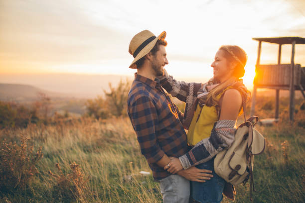 istock Young romantic couple having fun outdoors 968533056