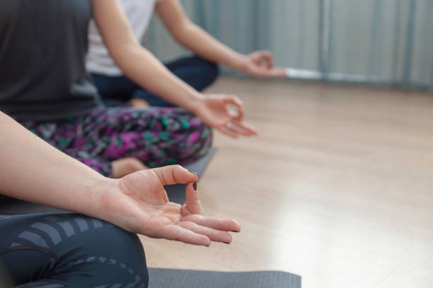 istock A woman doing om yoga 968533092