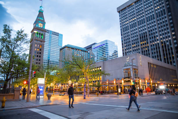 Denver Colorado Denver, Colorado, USA - May 1, 2018:  Street scene along the 16th Street Mall in downtown Denver Colorado at night with lights and people in view XVI stock pictures, royalty-free photos & images