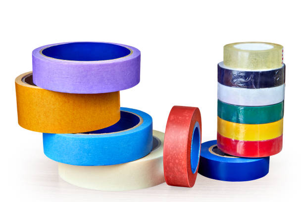 istock Coils of multi-colored adhesive tape for various purposes on white. 968540078