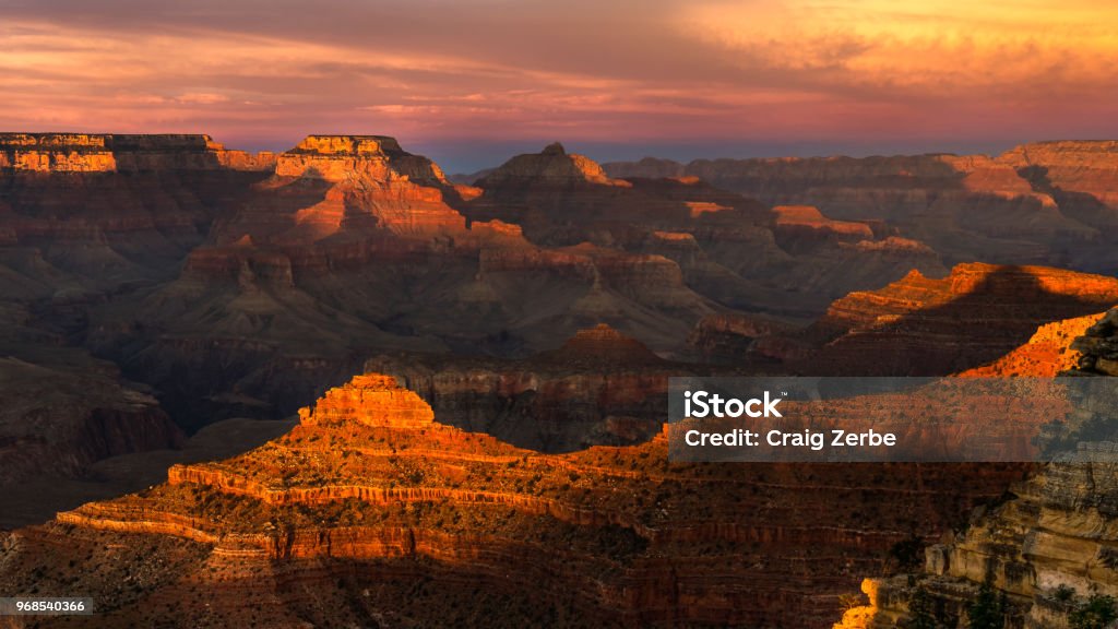 Grand Canyon Sunset at Mather Point End of day sun hitting the tops of the canyon walls. Arizona Stock Photo