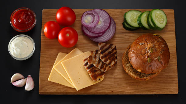 istock Ingredients for a sandwich on a black background. 968543144