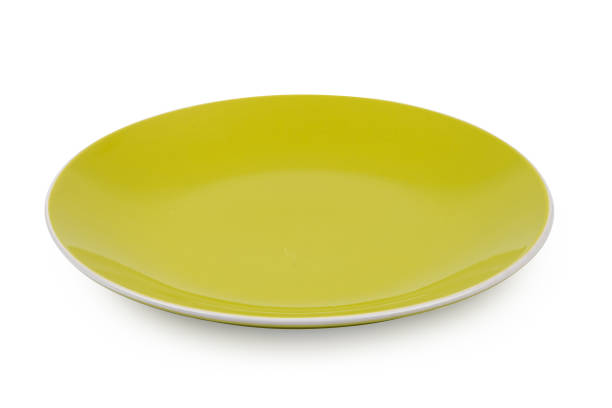 istock Green ceramic plate isolated on white background 968549386