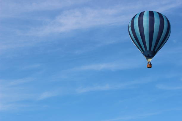 Free Stock Photo of Large Hot Air Balloon Flying Through Blue Sky ...