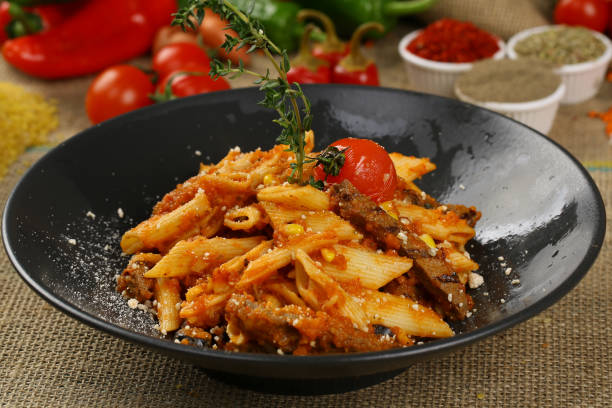 istock Penne pasta with beef meat and tomato sauce 968588380