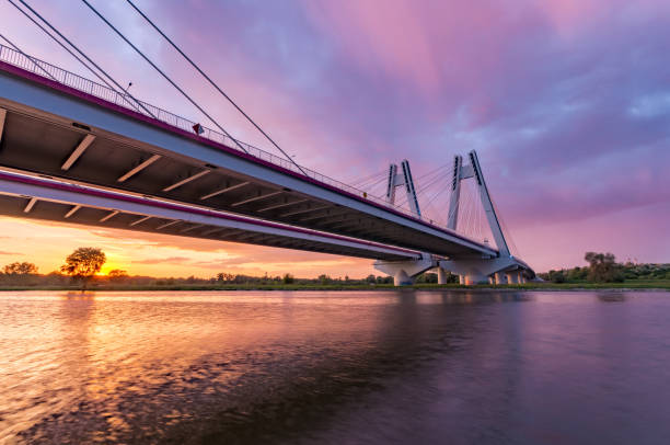 istock Cable stayed bridge over Vistula river, Krakow, Poland, beautiful colorful sunset 968591232