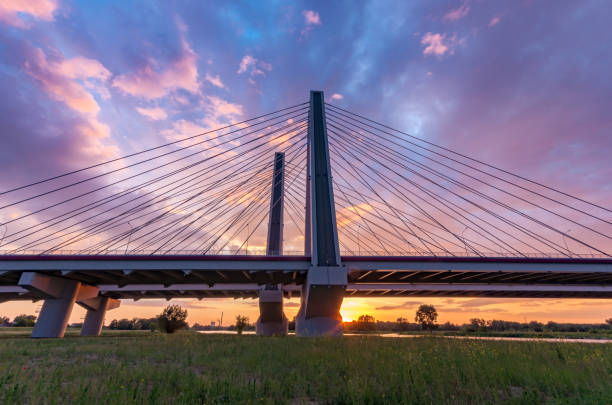 istock Cable stayed bridge over Vistula river, Krakow, Poland, beautiful colorful sunset 968591234
