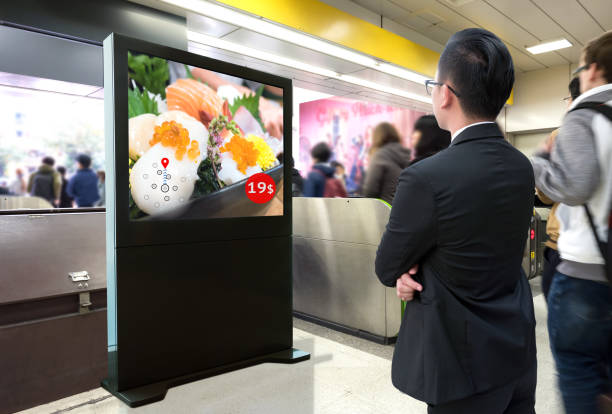 intelligent digital signage , augmented reality marketing and face recognition concept. interactive artificial intelligence digital advertisement sushi japanese restaurant in subway or sky train. - automatically imagens e fotografias de stock