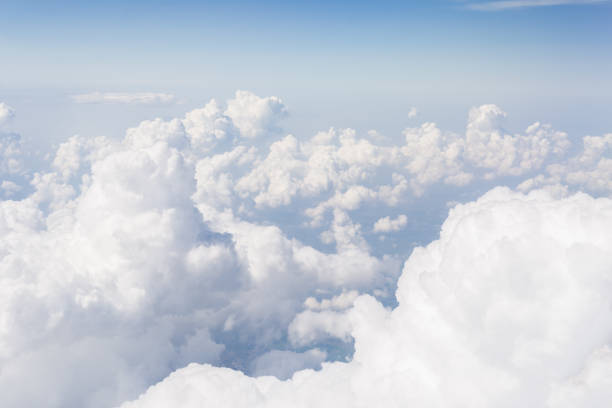 istock Skyline View above the Clouds from Airplane Window 968593908
