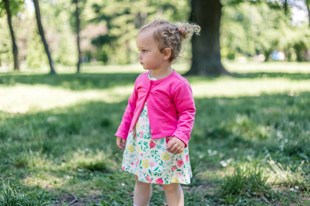 istock Little baby girl in park. 968596972