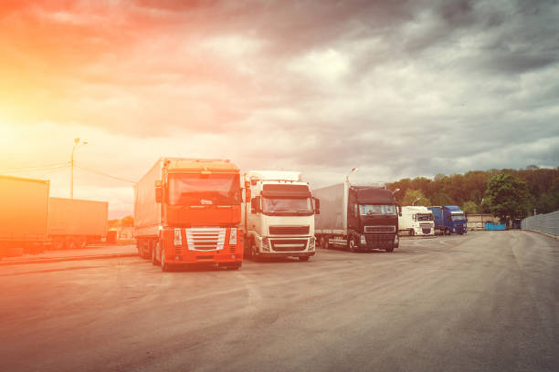 istock Logistic and transport concept, Container trucks for cargo delivery at sunset time 968599534