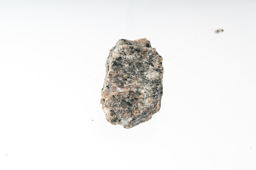 granodiorite mineral sample studio shot with white background