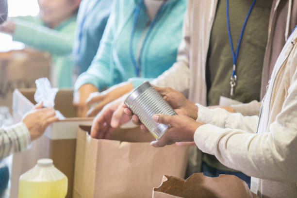 istock Unrecognizable people volunteering in food bank 968605952
