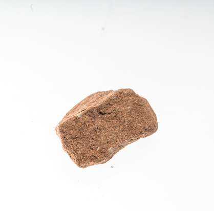 siltstone mineral sample studio shot with white background