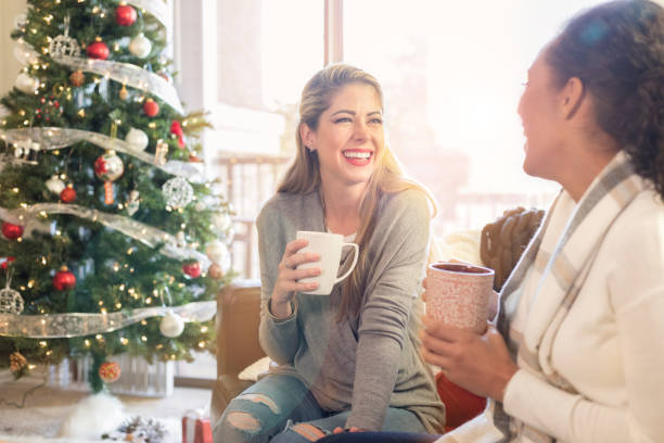 istock Female friends enjoy Christmastime 968606182