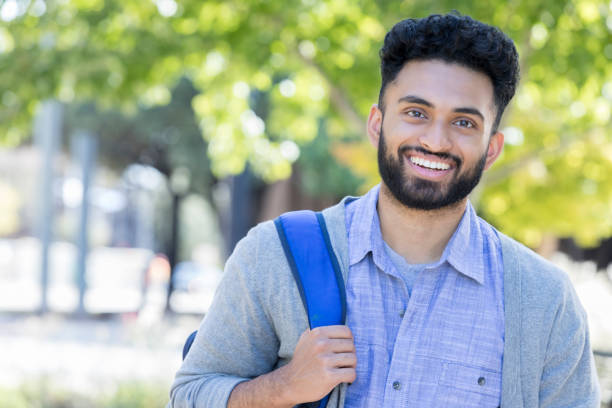 istock Portrait of handsome college student 968606346