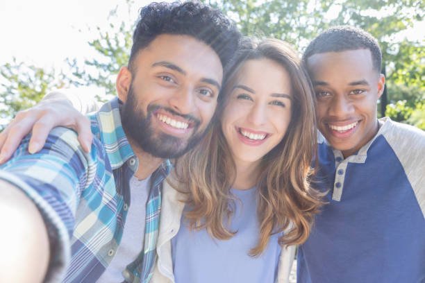 istock Diverse college buddies taking selfie 968606374