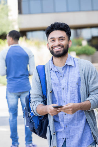 istock Handsome male Indian college student on his way to class 968606402