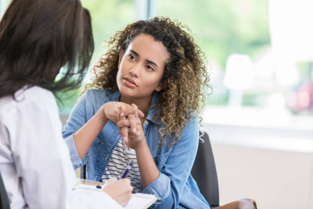 istock Young woman talks with doctor 968608480
