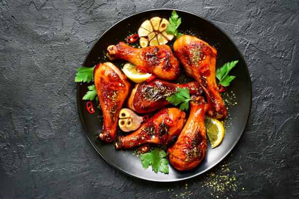 istock Roasted spicy chicken legs on a plate 968611766
