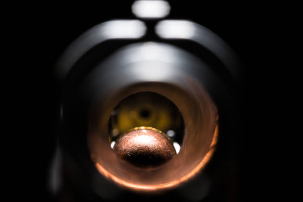 Macro view of weapon barrel with bullet at the end