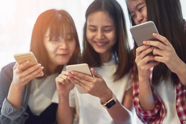 istock Woman using smartphone for the application on table in room. Concepts for digital technology in everyday Life. 968631166