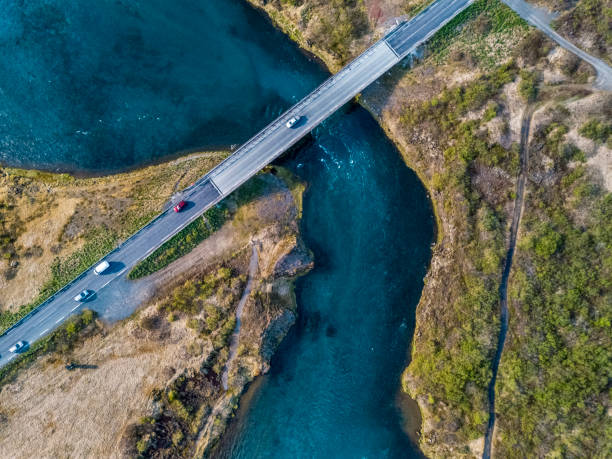 istock Cars passing over a bridge. 968633600