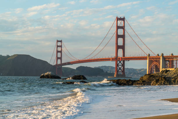istock Golden Gate Bridge at Sunset from Baker's Beach view 968636970