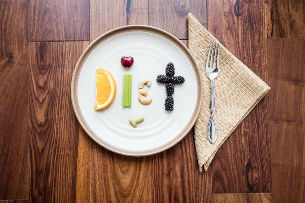 istock Food spelling Diet with napkin and fork 968639604