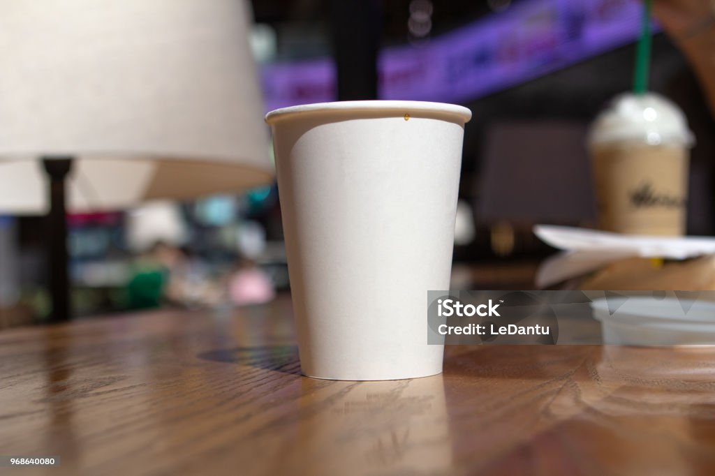 white glass mockap in a cafe background white glass of coffee mockap in a cafe background Blank Stock Photo