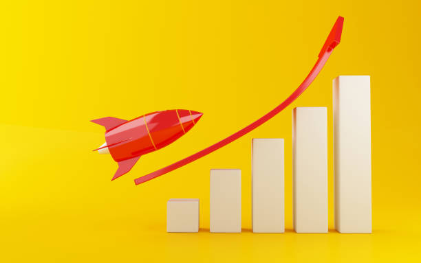 istock 3d Rocket aiming for the top of bar graph. 968642362