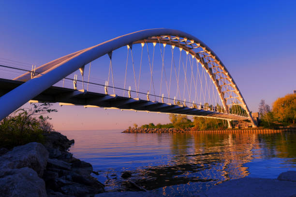 Pedestrian bridge at Lake Ontario Lake in morning light etobicoke stock pictures, royalty-free photos & images