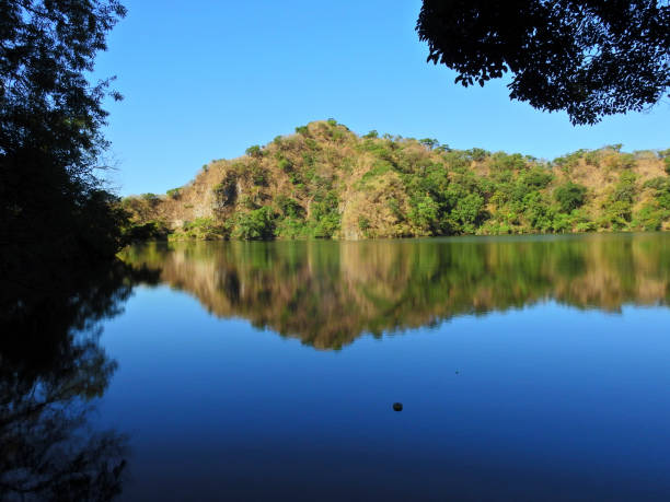 istock Stone on the calmed lake. 968663058