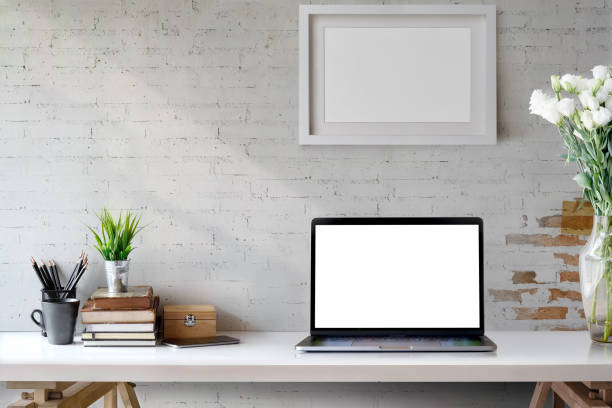 istock Mock Up workspace, Blank screen laptop and mockup poster on desk. 968665146