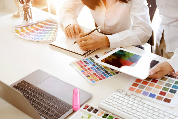 istock Team of creative designers working with tablet for new project in a design studio 968665268