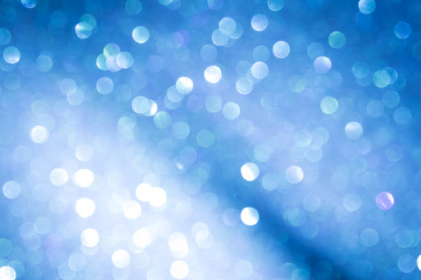 istock blue blur abstract background. bokeh christmas blurred beautiful shiny Christmas lights. 968676622